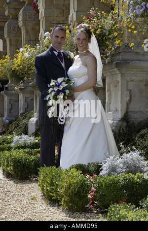 Bride and groom looking at camera Stock Photo