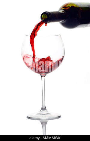 Red wine pouring down from a wine bottle Stock Photo