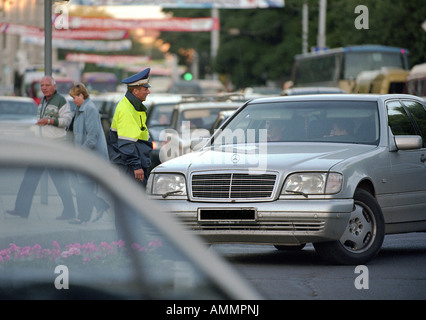 Traffic policeman talking to a driver, Kaliningrad, Russia Stock Photo