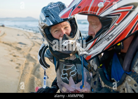 active adult couple on off-road motorcycle vacation in Baja, Mexico Stock Photo