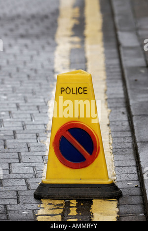 Police no waiting traffic cones sitting on double yellow lines Stock Photo