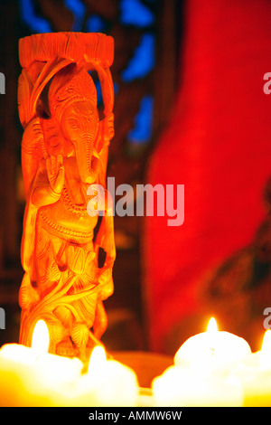 Carved Ganesha Idol in candle light, New Delhi, India Stock Photo