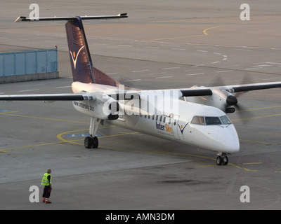 Short haul air travel. InterSky Bombardier Dash 8-Q300 propeller powered passenger plane starting up at Cologne/Bonn Airport Stock Photo