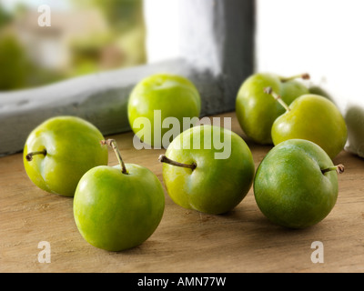 Organic fresh picked Greengage plum in a rustic kitchen Stock Photo