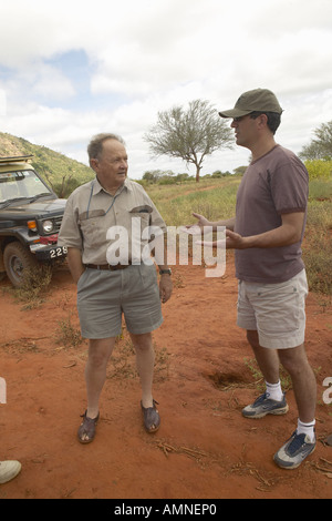 Cinematographer of Out of Africa speaking with Humane Society CEO Wayne Pacelle in Tsavo National Park Kenya Africa Stock Photo