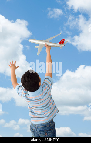 Boy Playing with Toy Airplane Stock Photo
