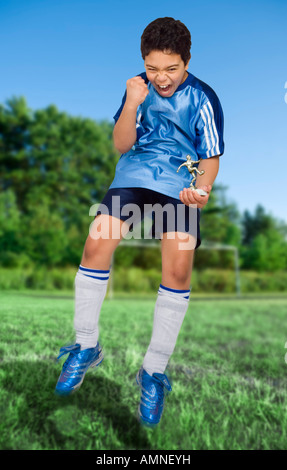 Boy Winning Soccer Trophy Stock Photo