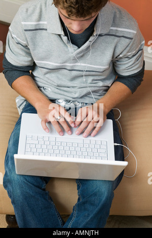 Teenage Boy Using Laptop Stock Photo