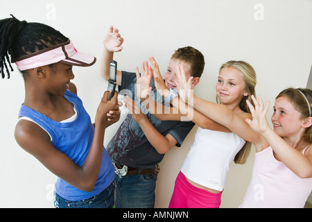 Kids Using Camera Phone Stock Photo