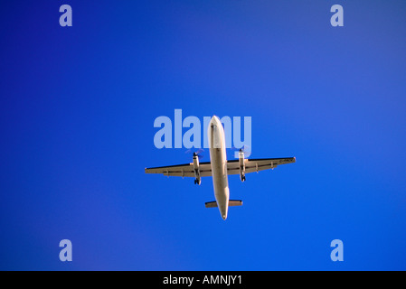 Airplane in Flight, Calgary, Alberta, Canada Stock Photo