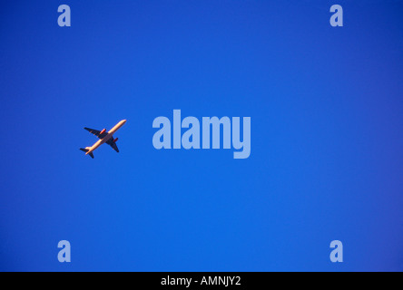 Airplane in Flight, Calgary, Alberta, Canada Stock Photo