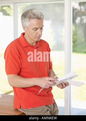 Man Holding Envelope Stock Photo
