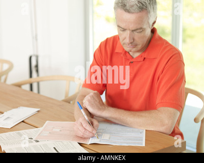 Man Doing Taxes Stock Photo