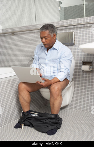 Man in the Washroom Stock Photo