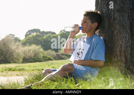 Boy Drinking Water After Race