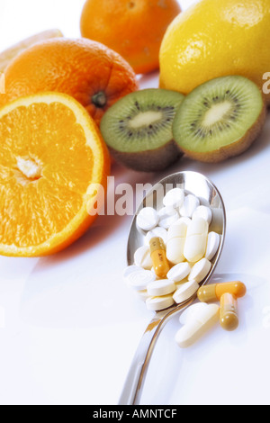 Fruits and vitamin pills Stock Photo