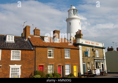 Adnam's Sole Bay brewery pub with Southwold lighthouse behind, Suffolk East England. Stock Photo