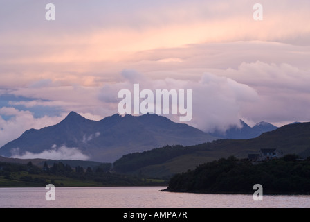 Evening light over Black Cuillin mountains from across Portree Bay, Isle of Skye, Scotland Stock Photo