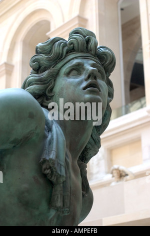 One can see the detail on this bronze sculpture of a Greek God at the Louve Museum in Paris France Stock Photo