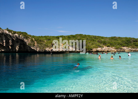People swimming in Dean's Blue Hole, Long Island, Bahamas Stock Photo