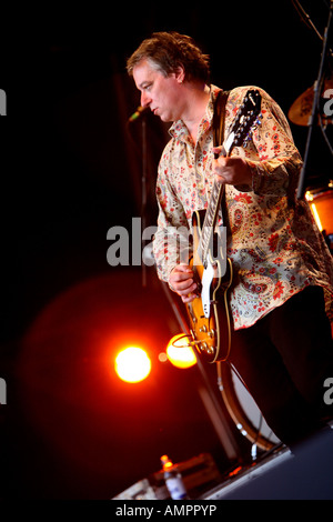 Peter Buck of REM ( R.E.M. ) playing on stage with Robyn Hitchcock and the Venus 3 Stock Photo