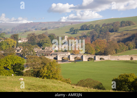 English landscape view to River Wharfe and bridge in Yorkshire Dales National Park Pennines in autumn. Burnsall Wharfedale Yorkshire England UK