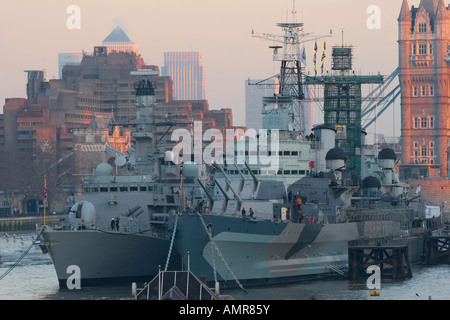 HMS Westminster (left) HMS Belfast (right) at Tower Bridge London Dec '07 Stock Photo