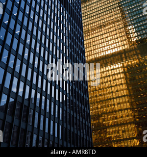 A generic image of an office building reflecting a cloudy sky in its ...