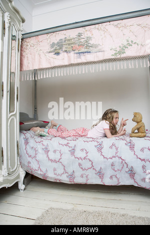 Girl Playing With Teddy Bear Stock Photo