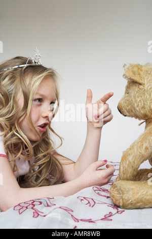 Girl Playing With Teddy Bear Stock Photo