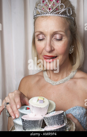 Woman Holding Cupcakes Stock Photo