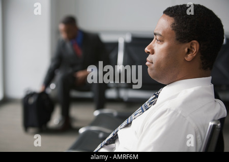 African businessman in waiting area Stock Photo