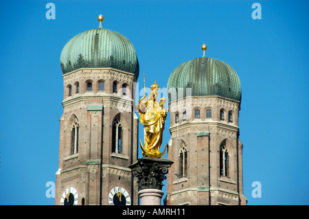 Column of Maria between towers of church Frauenkirche Marienplatz Munich Bavaria Germany Stock Photo