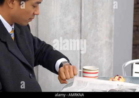 Businessman Looking At Watch Stock Photo