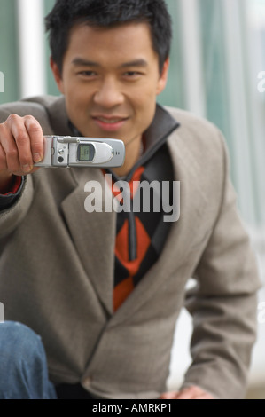 Man Taking Photo With Cell Phone Stock Photo