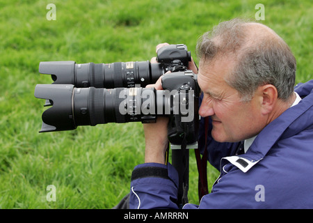 Photographer taking pictures at a horce race, Epsom, Great Britain Stock Photo