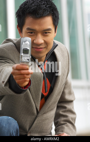 Man Taking Photo with Camera Phone Stock Photo