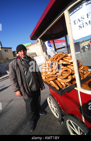 ISTANBUL. A man selling simits (sesame-coated pretzel-style bread) at Taksim Square. 2007. Stock Photo