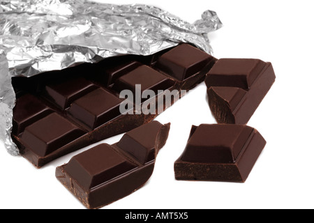 Bar of plain dark chocolate broken in foil Stock Photo