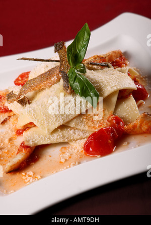 Fish and bakery with cherry tomato on square plate Stock Photo