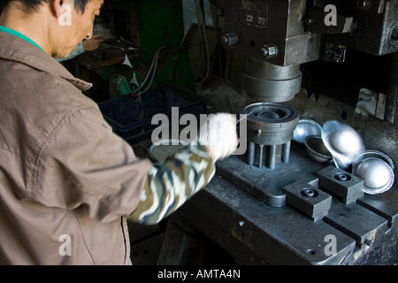 Chinese Man Working on a Manufacturing Factory Machine Guangzhou Guangdong Province China Stock Photo