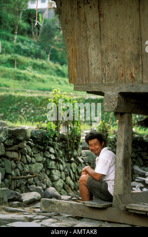Philippines Man Sitting Under His House In Ancient Rice Terrace Hungduan Stock Photo