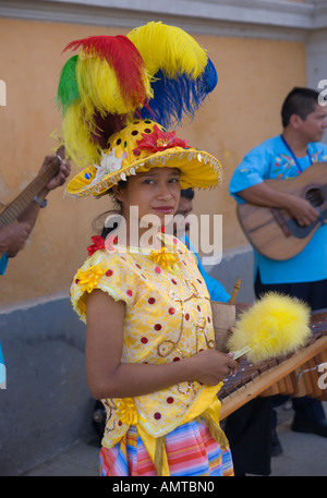 Attractive local young girl folk dancer in very colourful costume smiling shyly in Granada city Nicaragua Central America Stock Photo