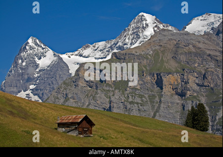 Old style swiss chalet in Mountains of switzerland Stock Photo