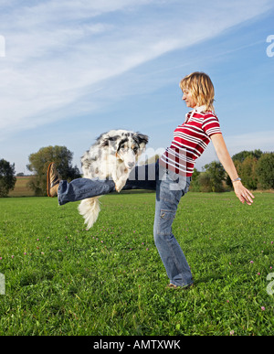 woman and Australian Shepherd dog Stock Photo