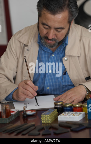 Haji Noor Deen Mi Guang Jiang from China, one of the great islamic calligraphers of our time Stock Photo