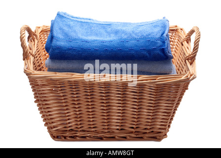 Willow storage laundry basket and towels Stock Photo