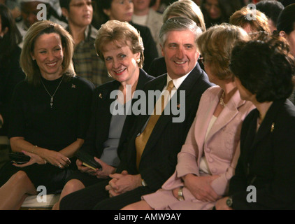 Chief of Staff Andrew Card talks with ladies of the Bush administration before a celebration of International Women's Day Stock Photo