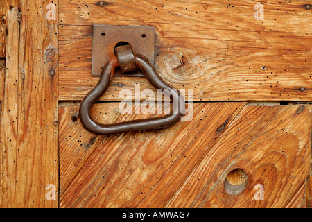 Door handle on an old wooden barn door Stock Photo