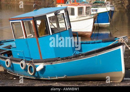 Fishing boats moored  in Port Seton harbour, East Lothian, Scotland at low tide Stock Photo